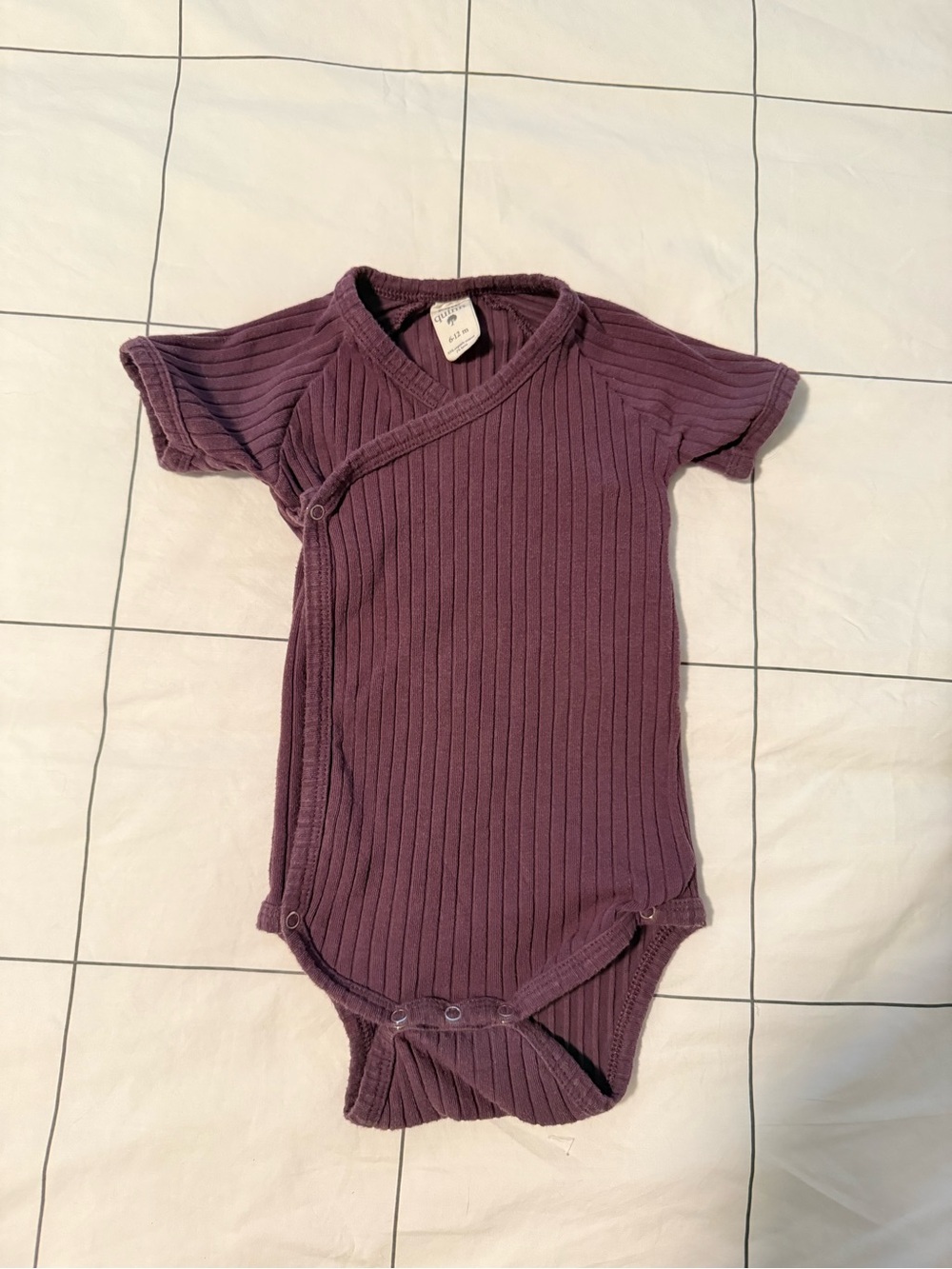 Kate Quinn Organic Cotton Ribbed Bodysuit in Deep Plum - 6-12m